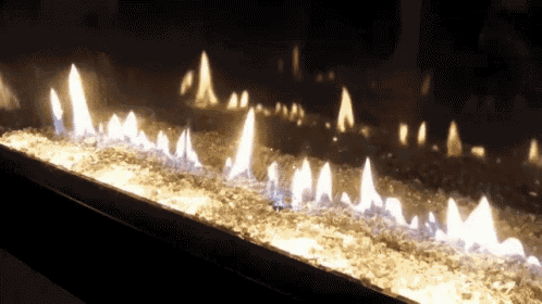 a fireplace with a lot of flames and smoke