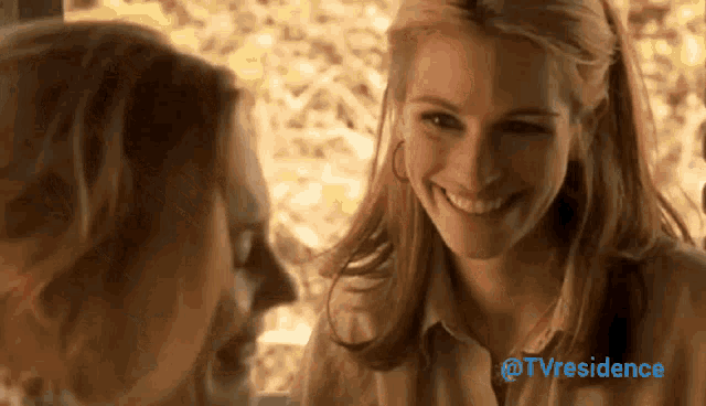 two women are smiling and looking at each other with the words tvresidence in the upper right corner