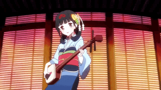 a girl in a kimono is holding a guitar