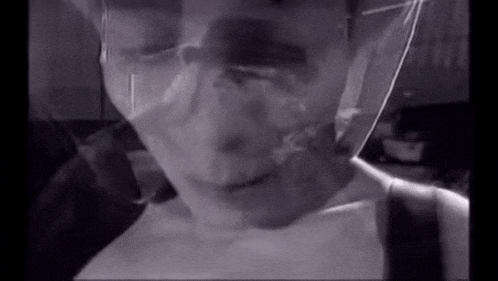 a close up of a person 's face with a mask on .