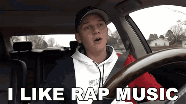 a man in a car with the words i like rap music above him