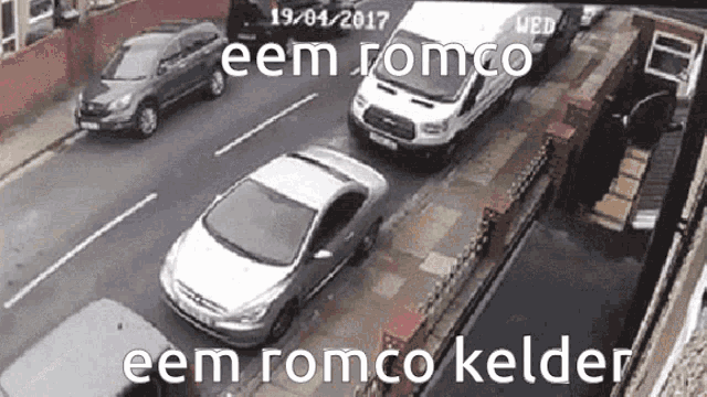 a row of cars are parked on the side of a street with the words eem romco eem romco kelder