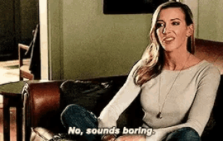 a woman is sitting on a couch with her legs crossed and saying `` no , sounds boring '' .