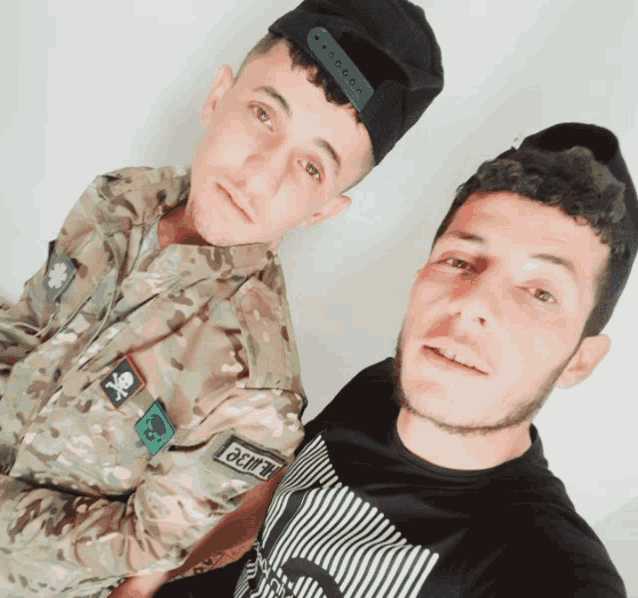 a man in a military uniform has a patch on his arm that says ' a.m.f.p. '