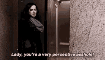 a woman is standing in front of an elevator and saying `` lady , you 're a very perceptive asshole ! ``