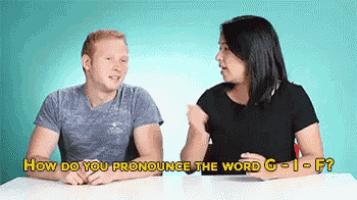 a man and a woman are sitting at a table talking about how to pronounce the word g - 1 - f .