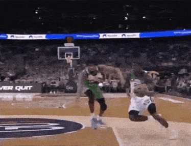 a basketball game is being played in a stadium with an ad for ver quit