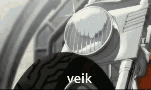 a close up of a motorcycle with the word veik on the bottom
