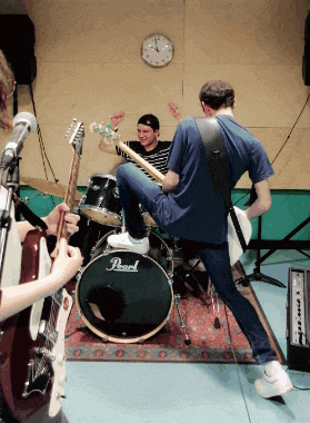 a pearl drum is being played by a band
