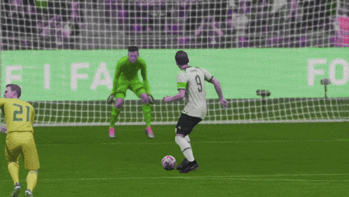 a soccer player wearing number 9 kicks the ball