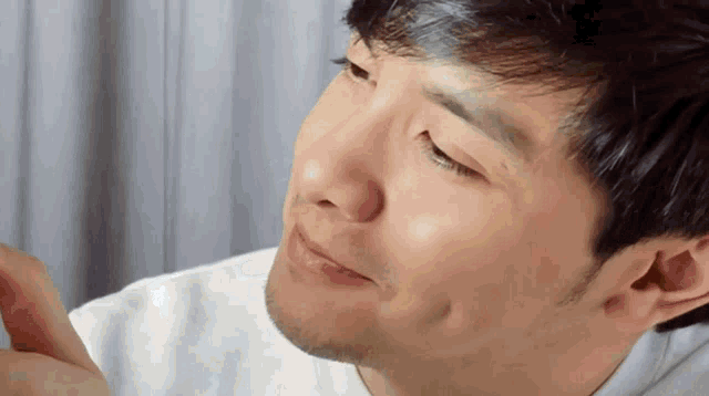 a close up of a man 's face looking at something