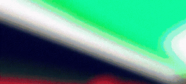 a close up of a green , white , and red background with a diagonal line .