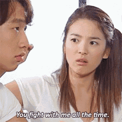 a man and a woman are standing next to each other and the woman is saying you fight with me all the time .