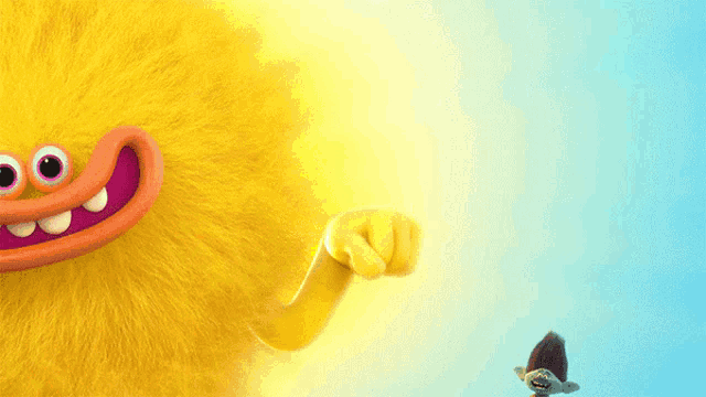 a troll is flying next to a yellow troll