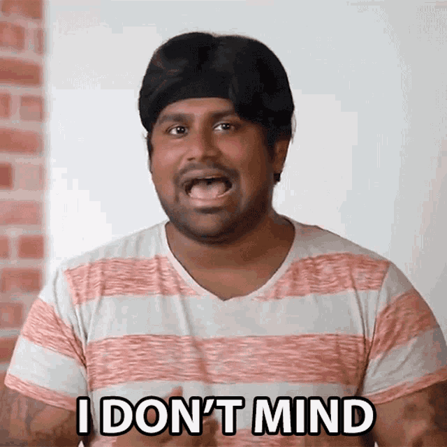 a man in a striped shirt is saying " i don 't mind "