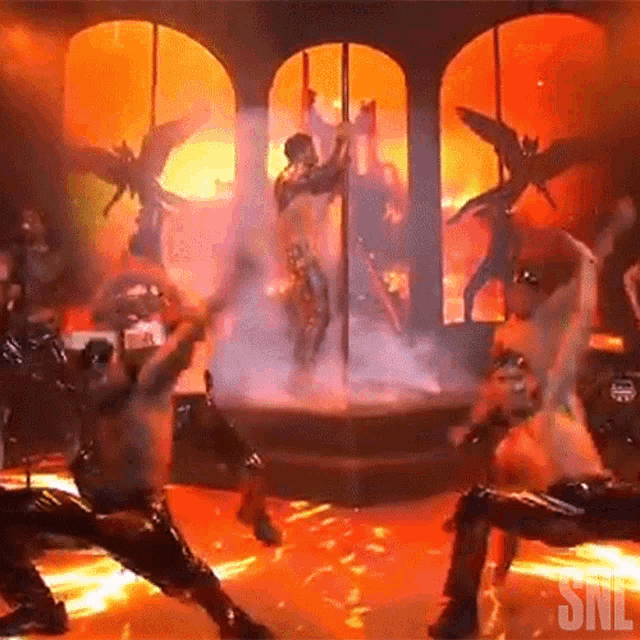 a group of dancers are performing on a stage with snl written on the bottom