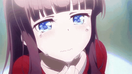 a close up of a girl with purple hair and blue eyes crying .
