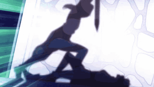 a shadow of a man holding a sword is cast on a wall .