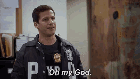 a police officer is standing in a room and says `` oh my god '' .