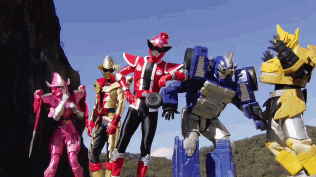 a group of toy robots standing next to each other with one of them having the number 3 on it