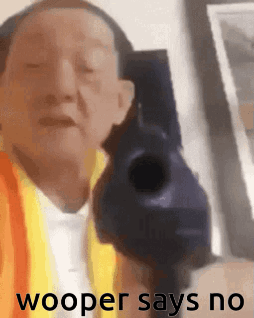 a man holding a gun with the words wooper says no written below him