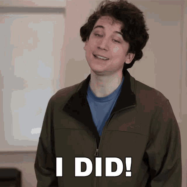 a young man wearing a green jacket says i did