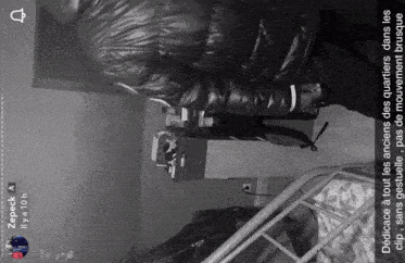a black and white photo of a man in a black jacket with a snapchat caption