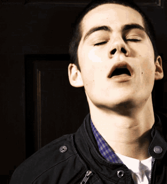 a close up of a man with his mouth open