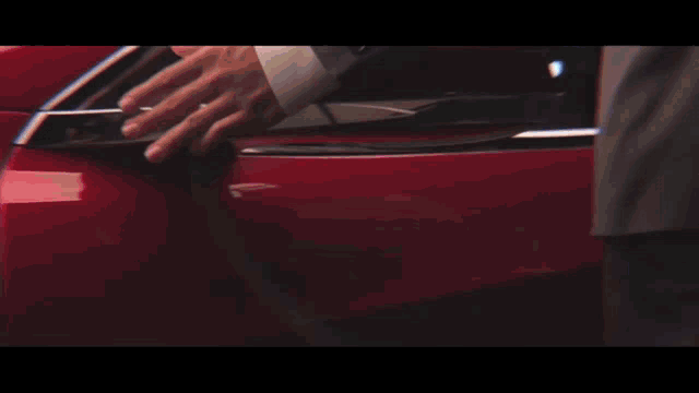 a close up of a red car headlight
