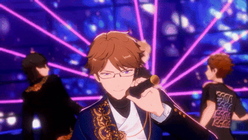 a man with glasses is holding a microphone in front of a neon background .