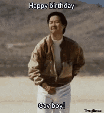 a man in a brown jacket and white pants says happy birthday gay boy ..