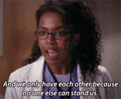 a woman wearing glasses and a lab coat is talking about each other because no one else can stand us .