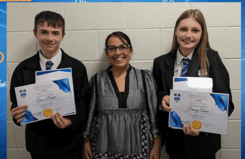 a boy and two girls are holding a certificate that says ' daisy amos ' on it