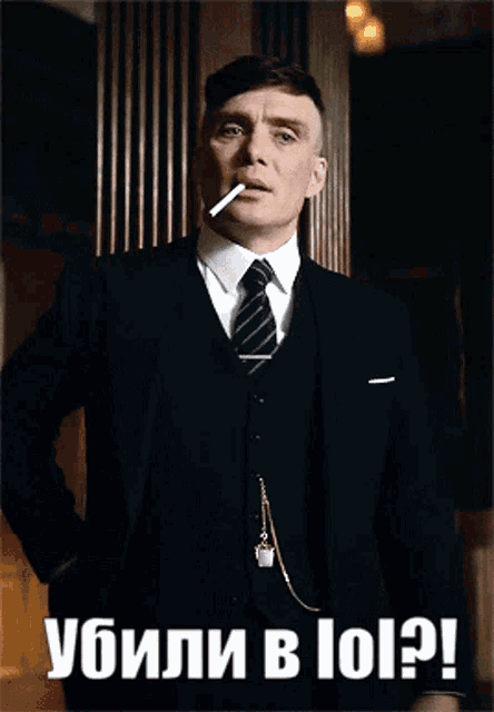 a man in a suit and tie is smoking a cigarette with the caption " killed in 101 ? "