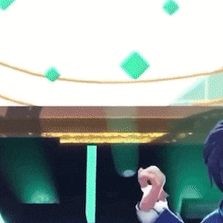 a man is standing in front of a table with green squares on it