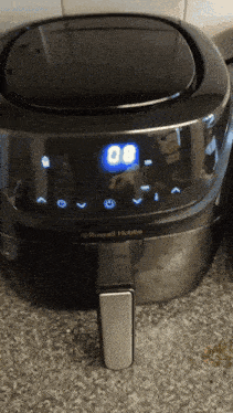 a russell hobbs air fryer is sitting on the counter