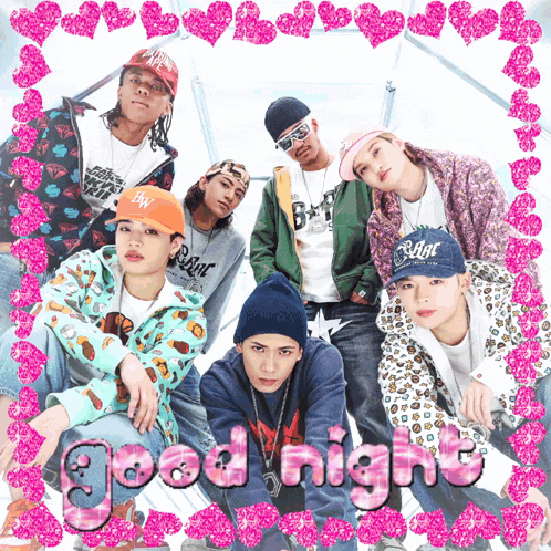 a group of young men are posing for a picture with the words good night written in pink