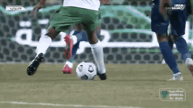 a soccer game is being played in arabic