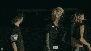 a person wearing a black shirt with the word hba on the waist
