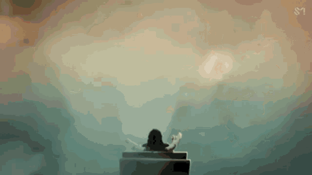 a close up of a woman 's face in a foggy room .