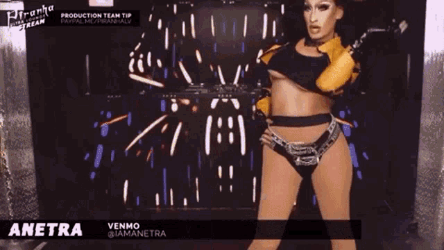 a woman in a yellow jacket is dancing with the name anetra on the bottom