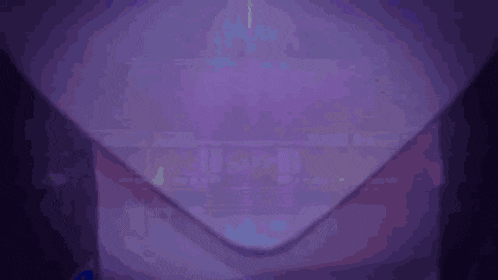 a close up of a person 's neck in a purple background