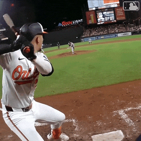 a baseball player with the word orioles on his uniform