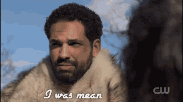 a man in a fur coat with the words i was mean below him