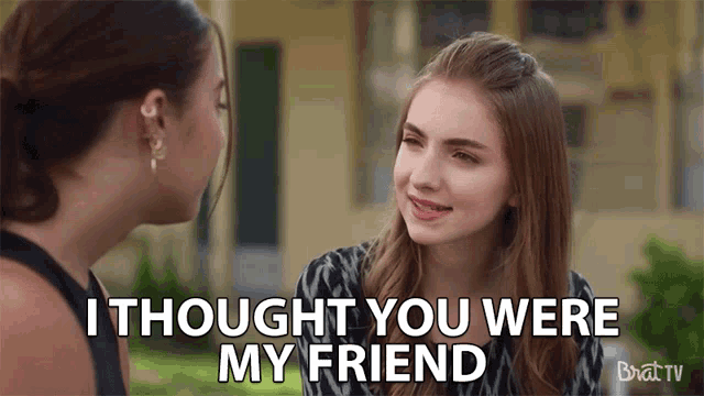 a woman talking to another woman with the words i thought you were my friend