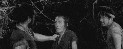 a group of men are standing next to each other in a forest .