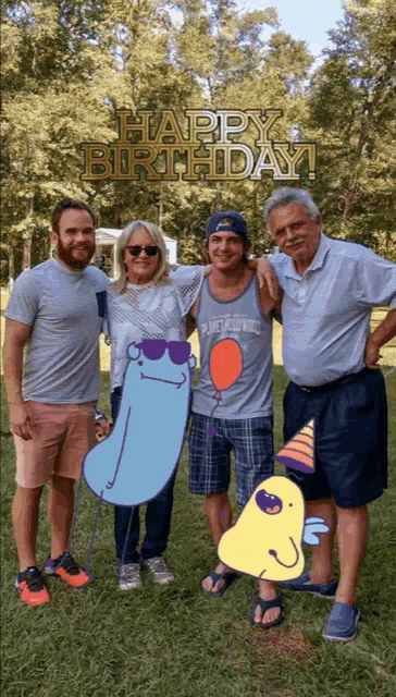 a group of people posing for a picture with the words happy birthday written above them