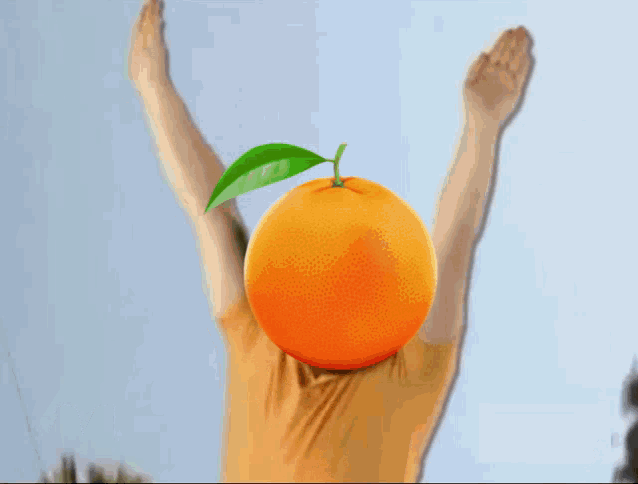 a man with his arms in the air has an orange in front of his head and the words mandarin wins