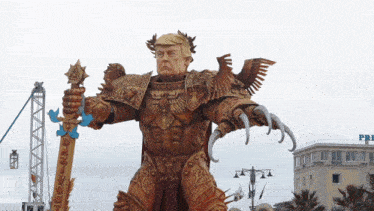 a statue of donald trump with a sword and a laurel wreath