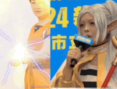 a person holding a microphone in front of a sign that says 24 on it